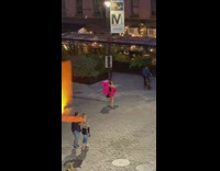 Woman pink dress lots of shopping bags