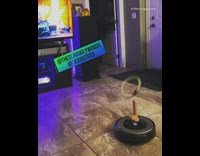 Friends play ring toss using roomba vacuum 