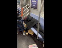 People asleep and wander inside subway train
