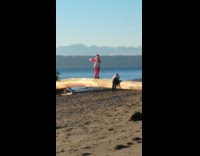 Man Santa Claus costume walk tree beach