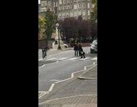 Woman black coat hesitate cross abbey road