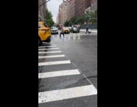 Man dance on road during red light