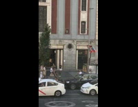 Man in white shirt street picture of woman