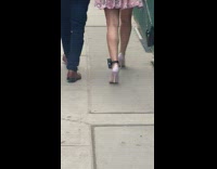 Woman walking in heels with ankle monitor 
