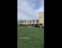 Guy runs around grass in underwear 