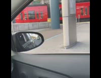 Lady sits next to her television