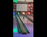 Guy play bowling and hit two pins