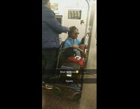 Guy with walker gets his hair braided and done on subway train