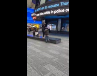 Man in black fur coat smokes and dance