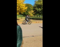 Two women tiktok dance at the park