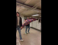 Man carry giant banana at subway NY 