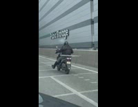 Man with Broken Leg Rides Motorcycle with its Crutches