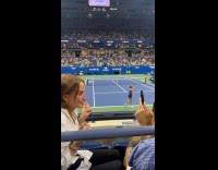 Woman tiktok video at US open match