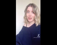 Girl shows old photo with different hair