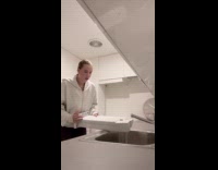 Woman emptying water from condensation tray