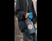 Man wears Homer Simpson mask on train