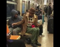 two guys passing small bottle of liquor