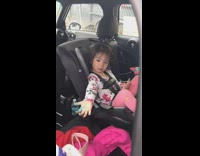 Little girl blue food coloring car seat