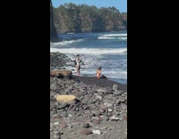 Woman in bikini lie down at the beach shore
