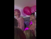 Machine Gun kelly on stage Megan Fox stares at back of head