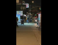 Two people dance while waiting for friends 