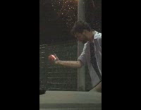 guy in blue shirt hitting beer with head