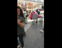 Person cat in the hat costume airport