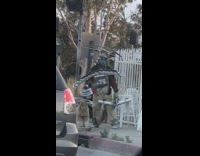 man with garbage dance street corner