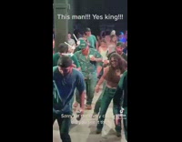 Man with beard dances on a party