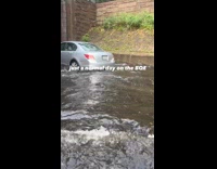 Collab WINY - Filmer in car pass through flooded road BQE