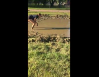 Girl hits volleyball into guys head