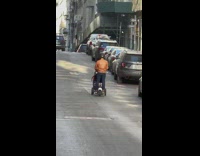 Person on segway ninebot pushes stroller 