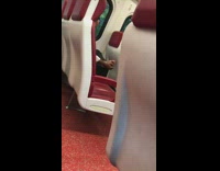 Train red seats person guy rubbing massaging feet