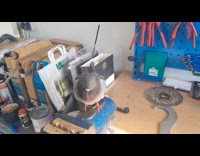 Guy talk to pigeon inside bike workshop