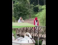 Woman in white hijab poses at the dock