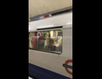 four men dressed as power rangers on train