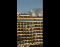 Lady Waves at People on Cruise Ship
