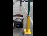 Collab WINY - Child stroller locked on a street pole