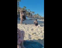 Woman bikini raise arm holding cup beach