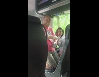 Guy dances to music on bus