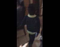 Guy chases little brother with raw chicken foot 