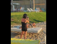 Woman grey dress lay pose beach bed