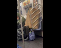 Collab Subway_Creatures - Person covered itself with box inside train