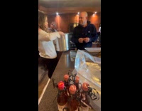 Man surprised with pet dog by family