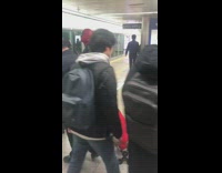 man in red deadpool costume on nyc train