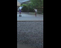Woman purple dress hold umbrella street rain