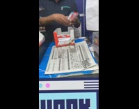 Guy takes entire case of chocolates register