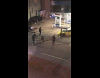 Guy sit yellow lamborghini gas station night