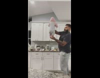 Dad balances baby on hand to freak out wife