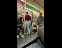 Woman dances randomly inside the subway train